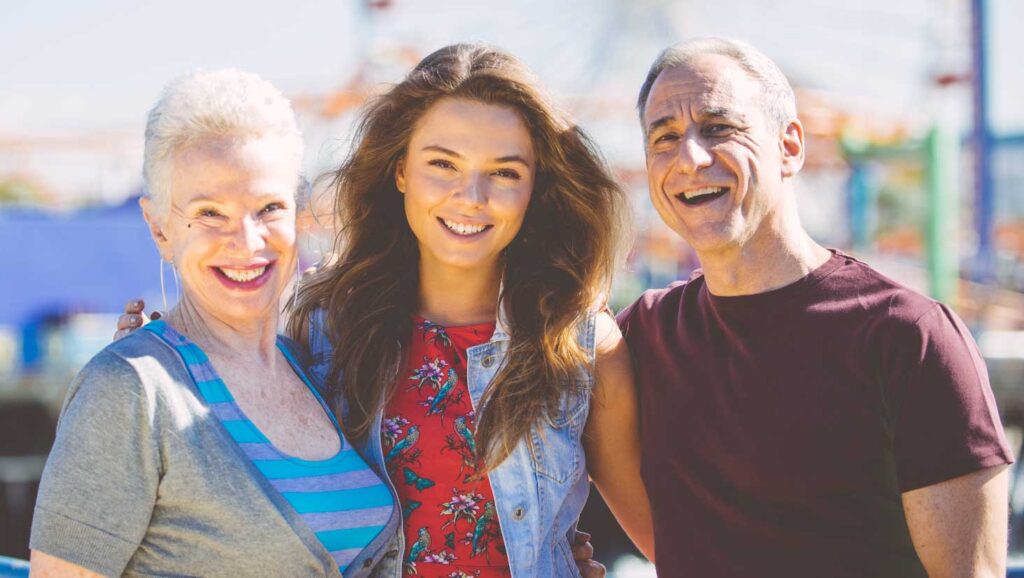 Photo of young woman with uncle and grandma.